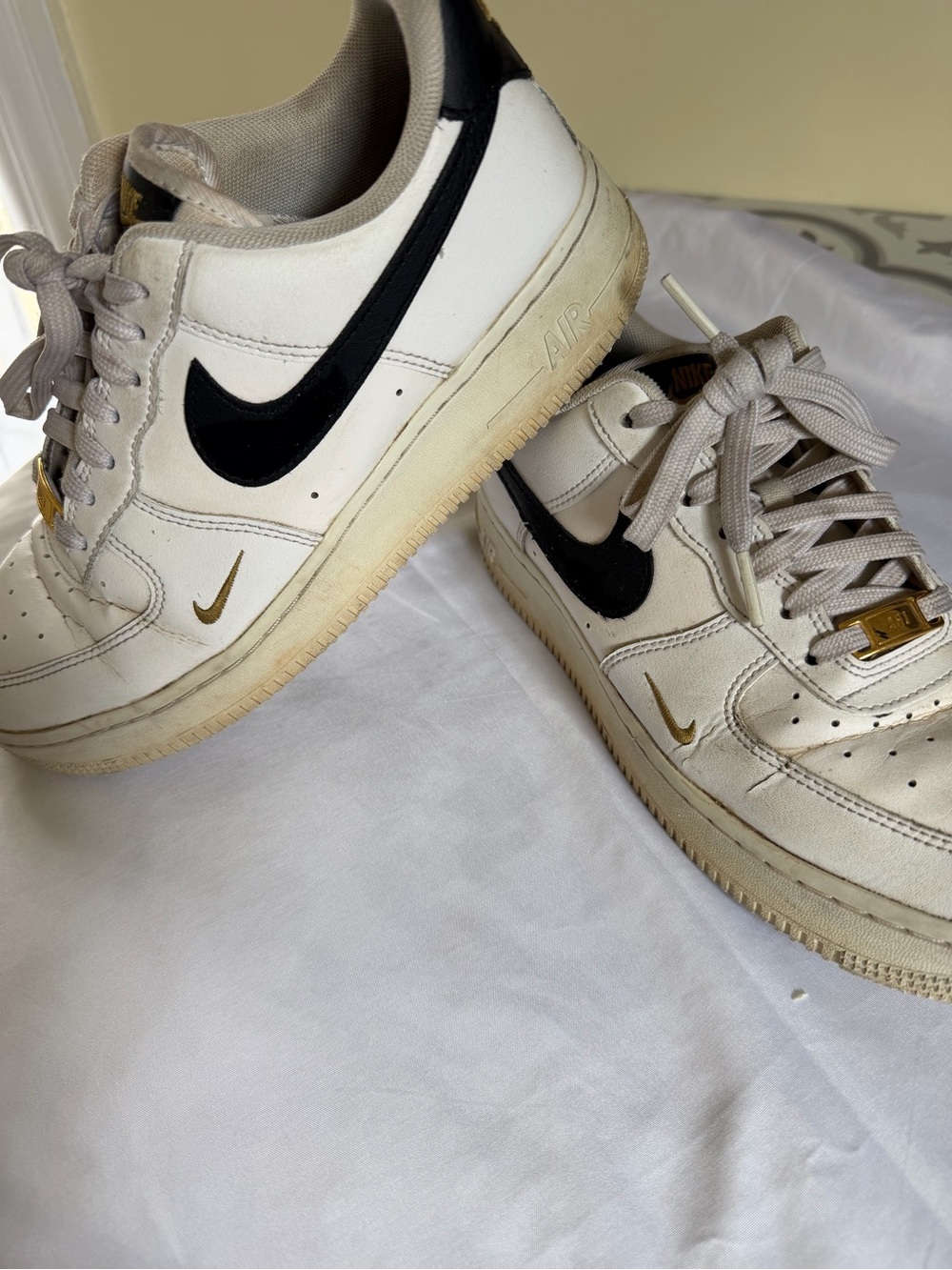 Nike White and Black Air Low-Top Sneakers with Gold Logo